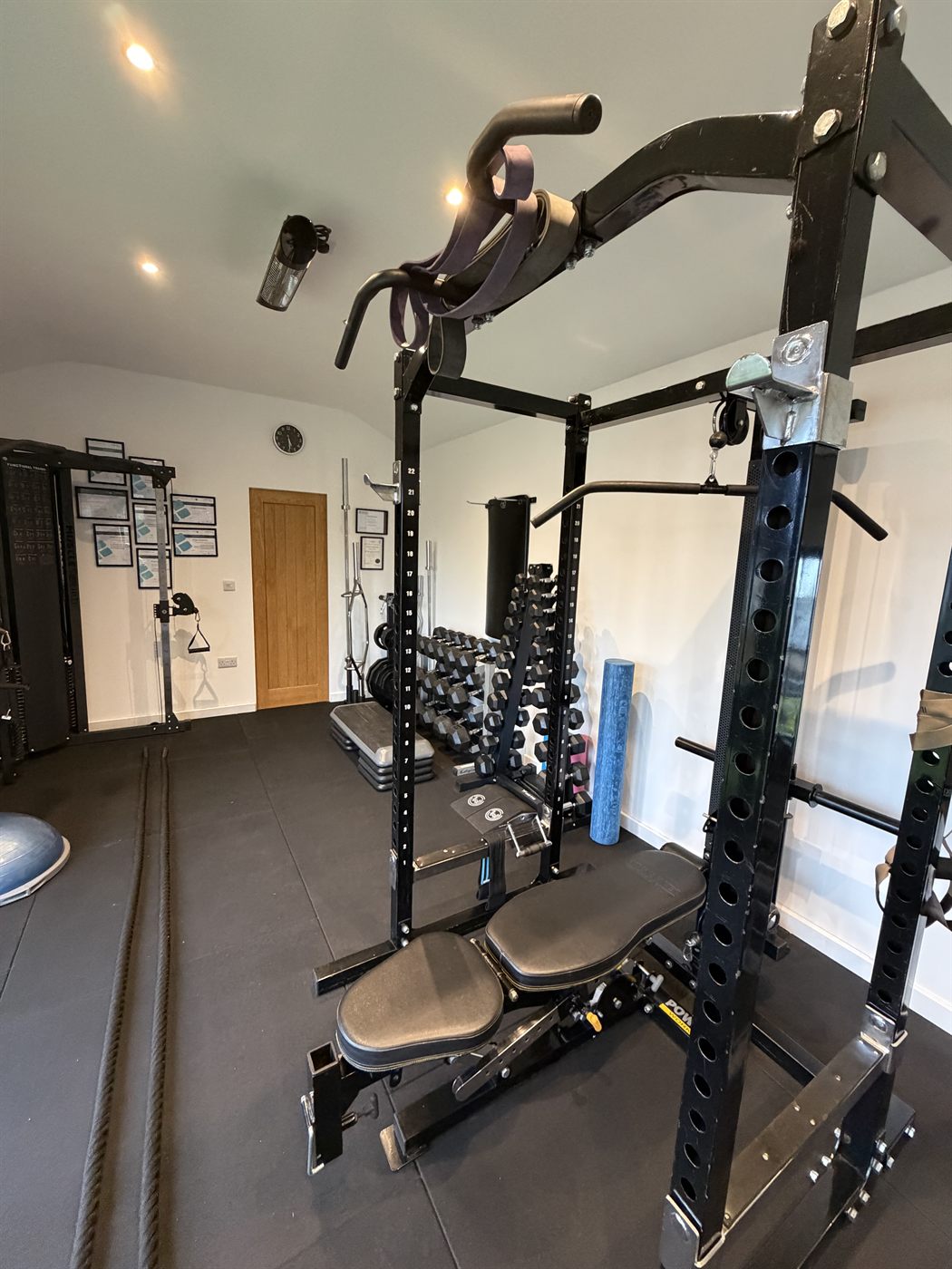 Power rack with adjustable bench